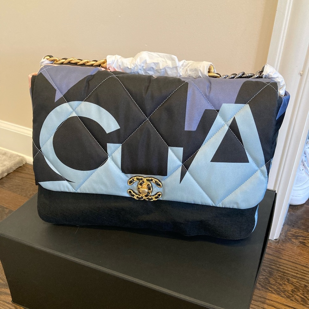 Chanel 19 Maxi flap bag in the color way blue/white/black.